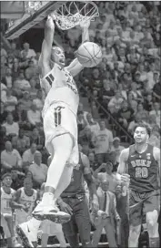  ?? Lee Luther Jr. Associated Press ?? VIRGINIA TECH forward Kerry Blackshear Jr. dunks against Duke en route to the Hokies’ 77-72 win.