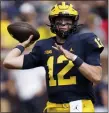  ?? ASSOCIATED PRESS FILE PHOTO ?? Quarterbac­k Cade McNamara, who started 16games during the past three seasons for Michigan, has entered the transfer portal.