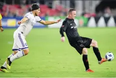  ?? NICK WASS/AP ?? The addition of European forward Wayne Rooney, right, has been a major impetus behind D.C. United’s ascent to the MLS playoffs.