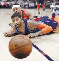  ?? AP FOTO ?? NICE VIEW. Oklahoma City Thunder forward Paul George and New Orleans Pelicans guard Tim Frazier watch the ball go out of bounds.