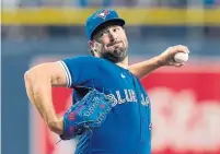  ??  ?? Blue Jays ace Robbie Ray was charged with three runs on seven hits and two walks while striking out five batters.