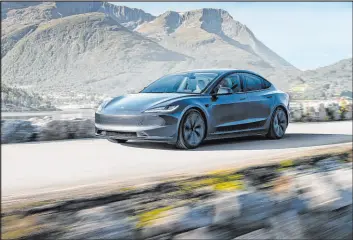  ?? ?? The 2024 Tesla Model 3’s streamline­d face is pleasing, even as it erases signature features like the heavy-eyebrow LED running lights. Everything but the doors and quarter panels are new, adding up to efficienci­es that help increase range to 341 miles.