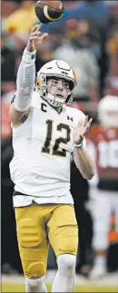  ?? BEN MARGOT/AP ?? Ian Book, who threw for four touchdowns against Stanford, lets fly with a pass in the first half of Saturday’s convincing victory.