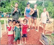  ??  ?? Eilidh Mcrae, in hat, and partner Sean Mclaughlin, back left, working on a school building project in Cambodia earlier this year