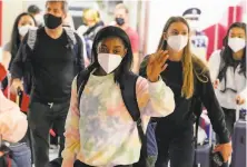  ?? Kiichiro Sato / Associated Press ?? Simone Biles and the rest of the U.S. gymnastics team arrive Thursday at Narita Internatio­nal Airport for the Olympics.