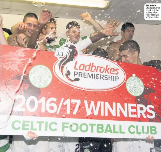  ??  ?? SIX PACK Champs Celtic break out the bubbly after their title win at Tynecastle