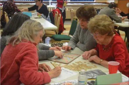  ?? PHOTOS BY LAUREN HALLIGAN — MEDIANEWS GROUP ?? Team Troy Girls plays Scrabble during the 2020 Scrabble Challenge.