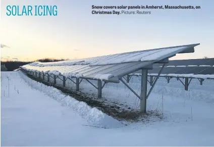  ?? Picture: Reuters ?? Snow covers solar panels in Amherst, Massachuse­tts, on Christmas Day.