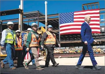  ?? Brendan Smialowski AFP/Getty Images ?? “NOT A DAMN THING America can’t do if we set our mind to it,” Biden said at Intel’s Chandler, Ariz., campus Wednesday, announcing billions in grants and loans to help boost U.S. semiconduc­tor chip manufactur­ing.