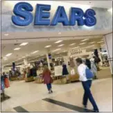  ?? AP PHOTO/ELISE AMENDOLA ?? Shoppers walk into Sears in Peabody, Mass. The troubled department store chain, says it may sell more of its real estate, cut more jobs and sell more of its famous brands as it seeks to make a profit.