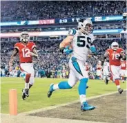  ?? MIKE EHRMANN/GETTY IMAGES ?? Carolina’s Luke Kuechly caps the Panthers’ romp by scoring a TD after intercepti­ng a pass in the 4th quarter.