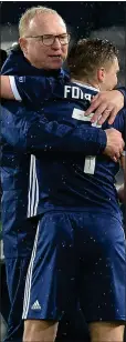  ??  ?? Alex McLeish hugs Forrest