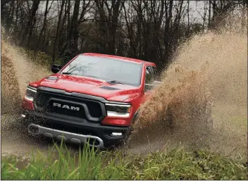  ?? FCA US LLC/TNS ?? The 2019 Ram 1500 Rebel mud pack test at Chelsea Proving Grounds in Chelsea, Mich.
