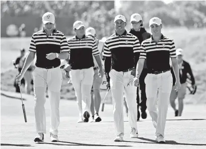  ?? AP ?? POWERHOUSE. Jordan Spieth of the US, Patrick Reed, Tiger Woods and Justin Thomas, from left, walk to the 18th green during a practice round for the Ryder Cup at Le Golf National in Saint-Quentin-en-Yvelines, outside Paris, France, Wednesday, Sept. 26, 2018.