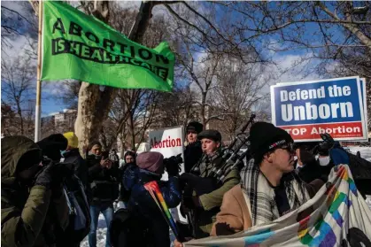  ?? ?? Abortion rights supporters and opponents protest in Washington DC on 20 January 2024. Photograph: Anna Rose Layden/Getty Images