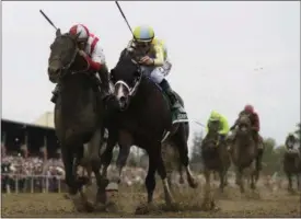  ?? MATT SLOCUM — THE ASSOCIATED PRESS ?? Cloud Computing (2), ridden by Javier Castellano, left, wins the 142nd Preakness Stakes at Pimlico Race Course as Classic Empire (5) with Julien Leparoux aboard takes second.