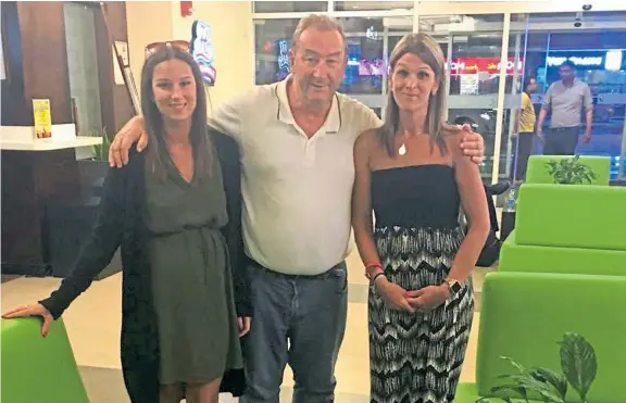  ??  ?? Malcolm David Faren, pictured with his daughters Jasmin, left, and Stephanie, has been left stranded in Dubai following a legal wrangle