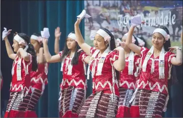  ?? NWA Democrat-Gazette/BEN GOFF • @NWABENGOFF ?? A group of Karen dancers from Clarksvill­e performs a ‘Dong dance’ Saturday during a Karen New Year celebratio­n at The Jones Center in Springdale. The Karen people are an ethnic group native to Southeast Asia.