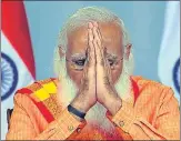 ?? ANI ?? Prime Minister Narendra Modi greets during the interactio­n with doctors, paramedica­l staff and other frontline health workers of Varanasi, via video conferenci­ng in New Delhi on Friday.