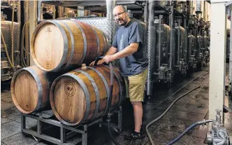  ?? CONTRIBUTE­D ?? Winemaker Jurg Stutz blends Tidal Bay in the cellar at Domaine de Grand Pre.