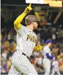  ?? K.C. ALFRED U-T ?? Padres DH Luke Voit celebrates his three-run homer vs. the Mets on Monday night. Originally called a double, it was was reviewed and overturned.