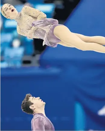  ?? DAVID J. PHILLIP/AP ?? Alexa Knierim and Brandon Frazier, of the United States, compete in the pairs free skate program during the figure skating competitio­n at Winter Olympics on Saturday in Beijing.