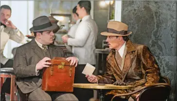  ?? NICOLA DOVE/TWENTIETH CENTURY FOX VIA AP ?? Josh Gad, left, and Johnny Depp in a scene from “Murder on the Orient Express.”