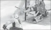  ?? Ethan Miller Getty Images ?? ALEX OVECHKIN gets a second-period shot past Marc-Andre Fleury to put Washington ahead 2-1.