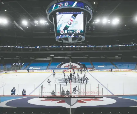  ?? JOHN WOODS/ THE CANADIAN PRESS ?? The upcoming NHL season, Scott Stinson writes, could see a team like the Winnipeg Jets end up in a playoff series against, say, Montreal, which could only have happened before in the Cup finals. Two Canadian teams are guaranteed to make it to the final eight.