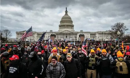  ?? Photograph: Jon Cherry/Getty Images ?? Pro-Trump protesters in front of the Capitol building on 6 January, 2021.