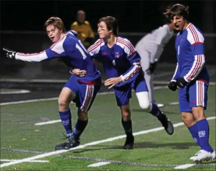  ?? RANDY MEYERS — THE MORNING JOURNAL ?? Bay’s Kyle Cusimano scored the first goal against Aurora, He is mobbed by Sam Shank, center, and Noah Beck.