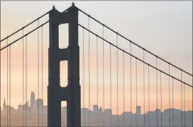  ?? MARCIO JOSE SANCHEZ / ASSOCIATED PRESS ?? Smoke from wildfires fills the morning air Friday in a view of San Francisco through the Golden Gate Bridge from the Marin Headlands.