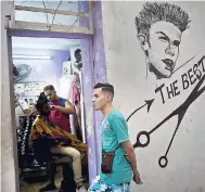  ?? AP ?? A client waits his turn to get his hair cut at a private barber shop, which is part of a cooperativ­e, in Havana, Cuba, on Wednesday, January 31.