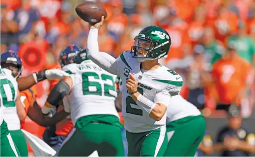  ?? JUSTIN EDMONDS/GETTY IMAGES ?? Jets quarterbac­k Zach Wilson, who missed the last four games with a knee injury, is expected to start Sunday against the Texans.