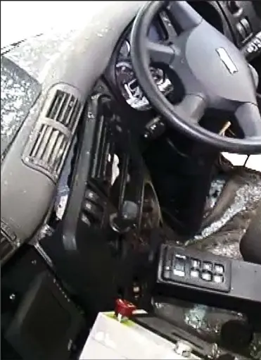  ??  ?? Harrowing: An image from police accident investigat­ors’ footage shows broken glass and debris strewn across the lorry’s cab, including the driver’s seat