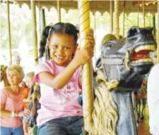  ?? JOHN ROBINSON PHOTO ?? The carousel at Lake Winnepesau­kah was built in 1916 by the Philadelph­ia Toboggan Co. It features 68 hand-carved and hand-painted horses, and no two are alike.