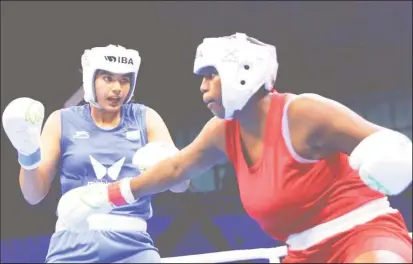  ?? ?? Guyana’s Abiola jackman in action against India’s Nupur Sheoran in March at the World Championsh­ips