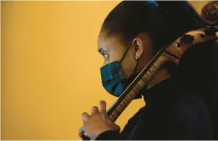  ?? ARMANDO L. SANCHEZ/CHICAGO TRIBUNE ?? Civic Orchestra member Lindsey Sharpe performs before members of the Chicago Symphony Orchestra perform Florence Price’s Symphony No. 3. Price became the first Black woman to have a symphonic work performed by a major symphony orchestra when the CSO played her Symphony No. 1 for the 1933 Century of Progress World’s Fair exposition.