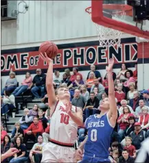  ?? TIM GODBEE / For the Calhoun Times ?? Sonoravill­e’s Wil Walraven (10) goes up for a shot over Bremen’s Dalton Smith during Friday’s game.
