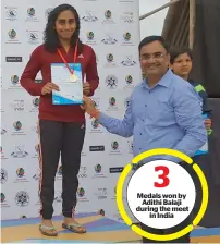  ?? Supplied photo ?? Adithi Balaji receives her medal and certificat­e at the Junior National Aquatic Championsh­ips held in India. —