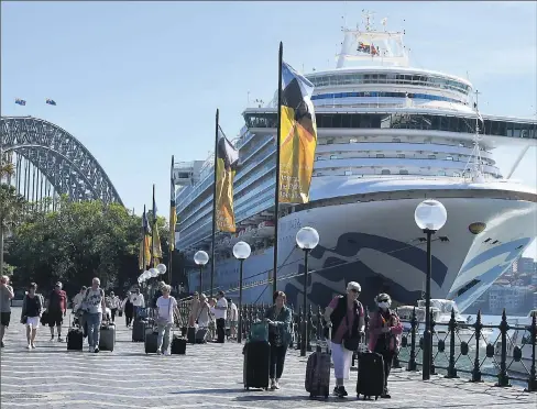  ?? Picture: AAP Image/Dean Lewins ?? Not so smooth sailing: Cruise ship passengers disembark from the Princess Cruises-owned Ruby Princess at Circular Quay in Sydney.