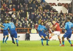  ??  ?? Nottingham Forest’s US defender Eric Lichaj (2R) scores the team’s second goal during the English FA Cup third round football match between Nottingham Forest and Arsenal at The City Ground in Nottingham, central England, on January 7, 2018. - AFP photo