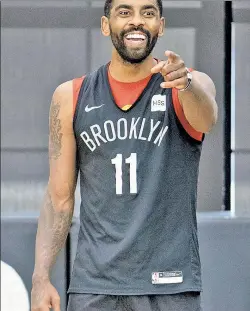  ?? Getty Images ?? REASON TO SMILE: Kyrie Irving had been ineligible to practice at HSS Training Center until New York City determined the facility is a private office building rather than an indoor gym.