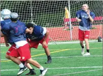  ?? File photo by Ernest A. Brown ?? The Lincoln football team is one of a number of Valley teams to take advantage of practices with rival schools.