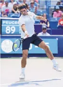  ?? JOHN MINCHILLO/ASSOCIATED PRESS ?? Roger Federer focuses on a return during Sunday’s final against Novak Djokovic. Federer fell in two sets, 6-4, 6-4.