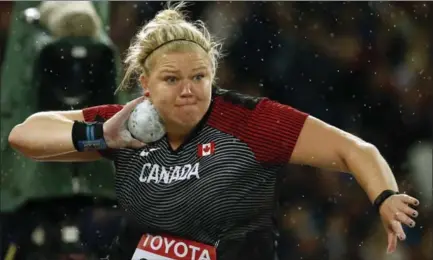  ?? MATT DUNHAM, THE ASSOCIATED PRESS ?? Canada’s Brittany Crew pushes the power button during the world athletics championsh­ips in London on Wednesday. She finished sixth.