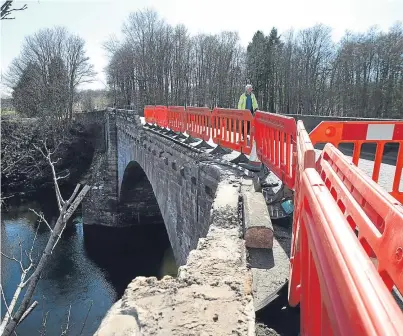  ?? Pictures: Kris Miller. ?? A workman on the bridge as work continues to assess the damage.