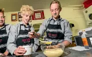  ??  ?? Nathan Morris, 13, and Jayke McGrath, 14, layer up the tiramisu.