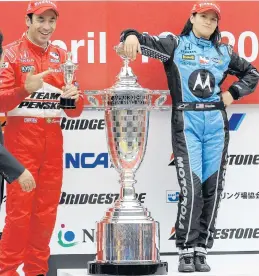  ?? By Melissa Isaacson
KATSUMI KASAHARA/AP ?? Danica Patrick, right, poses with her trophy on the podium as second-place finisher Helio Castroneve­s shows his smaller one after the Indy Japan 300 at Twin Ring Motegi.