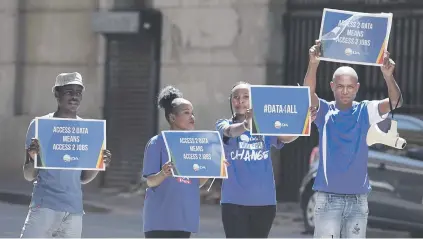  ?? Picture: Neil McCartney ?? PROTEST. DA Youth members ask people at Gandhi Square in Joburg to sign a petition demanding 500MB free data for students and jobseekers yesterday.